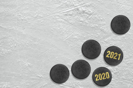 Hockey pucks and a fragment of the ice arena. Concept, hockey, seasonの写真素材