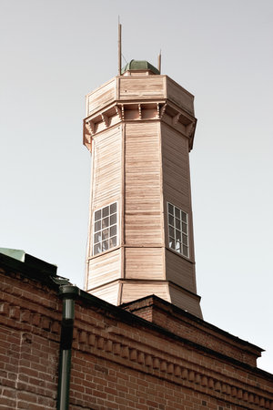 An old fire tower in a historical urban area. Architecture, exterior
