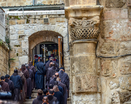 Procession of mostly priests or monks entering the Church of the Holy Sepulchre during Easter Celebration in Jerusalem, Israel.のeditorial素材