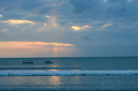 Boats On the Water At Sunset In Kuta Beach, Bali, indonesiaの写真素材