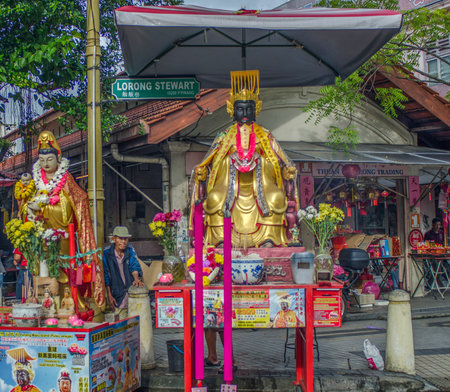 Two Ornately Dressed Statues For Offerings on Lorong Stewart in Penangのeditorial素材