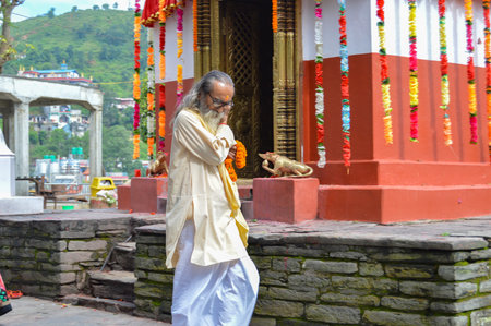 Kathmandu, Nepal - September 7, 2016 Holy Man Walking Around Temple On Top Of Hill In Nepalのeditorial素材