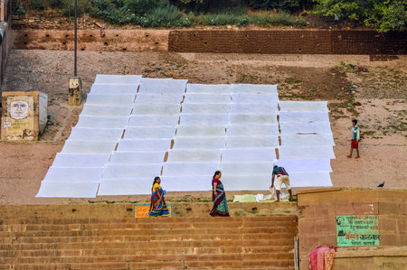 Laundry Drying On the Ghat Steps At Start of Day in Varanasi, Indiaのeditorial素材