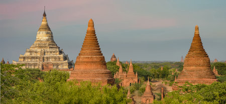 Multiple Sizes and Shapes of Temples, Stupas, and White Shwesandaw Pagoda Panorama in Bagan, Myanmarの写真素材