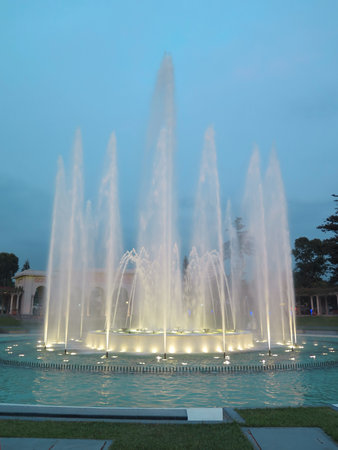 Illuminated colorful fountains at nightの写真素材
