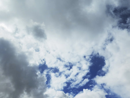 White fluffy clouds closeup in the blue sky