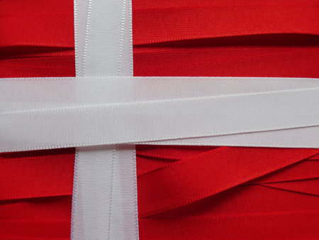 Denmark flag or banner made with red and white ribbonsの写真素材