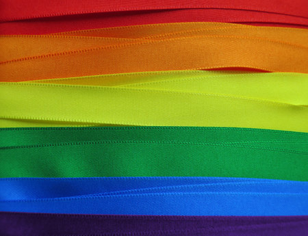 Gay flag or banner made with red, orange, yellow, green, blue and purple ribbonsの写真素材