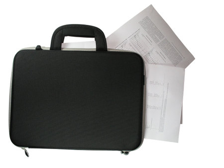 black briefcase with business paper documents in it isolated over white backgroundの写真素材