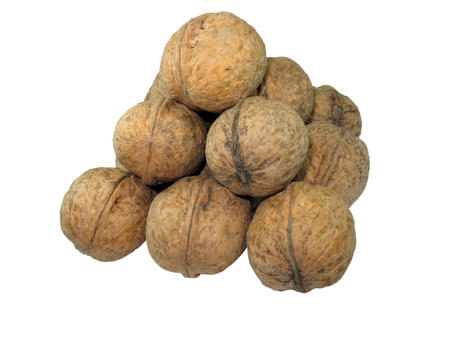 Pyramid from walnuts isolated over white backgroundの写真素材