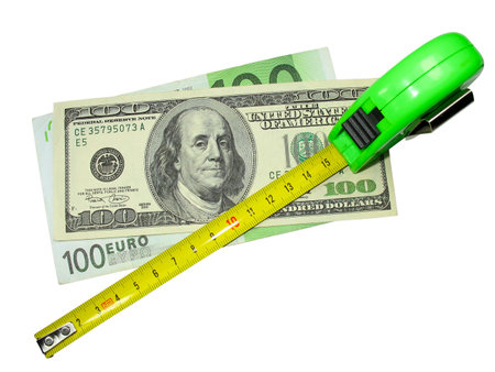 crisis: measuring tape, us dollar and euro currency isolated on whiteの写真素材