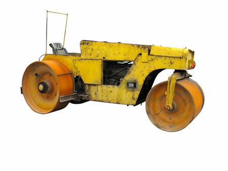 Old rusty yellow road roller isolated over white backgroundの写真素材