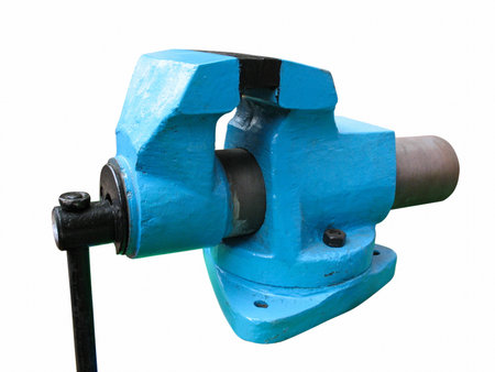 Old blue table mechanical vise clamp on white backgroundのeditorial素材