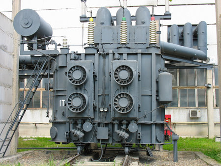 Huge industrial high-voltage substation power transformer at an power plantの写真素材
