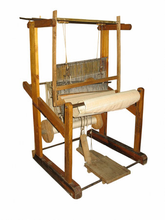 Ancient wooden loom isolated over white backgroundの写真素材