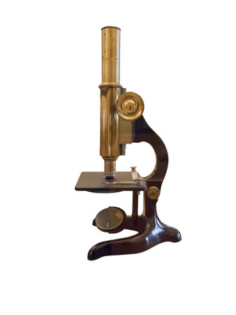 Old vintage microscope isolated over white backgroundの写真素材