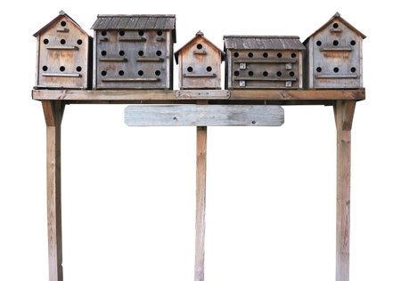 Old wooden starling nesting boxes bird house isolated over white backgroundの写真素材