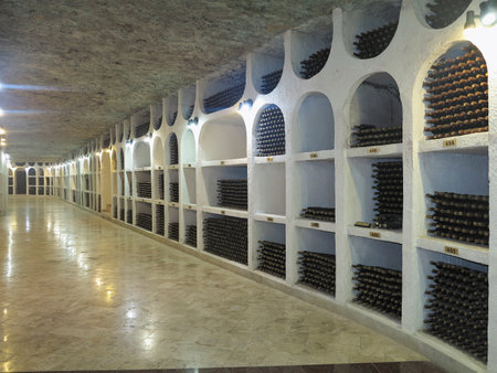 3.10.2015, Moldova, Cricova. Big underground wine cellar with collection of bottles in nichesのeditorial素材