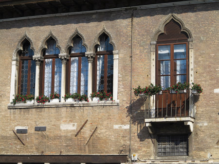 Vintage window and detail of a classical building in the historical center of Venezia, Italyの写真素材