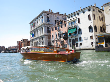 20.06.2017, Venice, Italy: View from gondola to historic buildings and canalsのeditorial素材