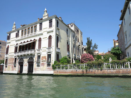 20.06.2017, Venice, Italy: View from gondola to historic buildings and canalsのeditorial素材