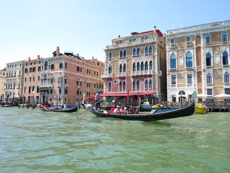 20.06.2017, Venice, Italy: View from gondola to historic buildings and canalsのeditorial素材