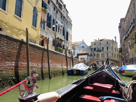 20.06.2017, Venice, Italy: View from gondola to historic buildings and canalsのeditorial素材