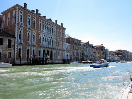 20.06.2017, Venice, Italy: View from gondola to historic buildings and canalsのeditorial素材