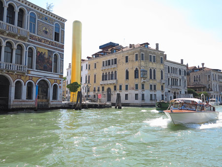 20.06.2017, Venice, Italy: View from gondola to historic buildings and canalsのeditorial素材