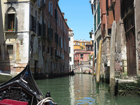 20.06.2017, Venice, Italy: View from gondola to historic buildings and canalsのeditorial素材