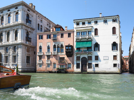 20.06.2017, Venice, Italy: View from gondola to historic buildings and canalsのeditorial素材