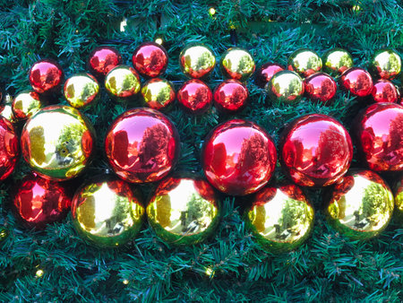 Christmas abstract background with shiny ball decorations and green treeの写真素材