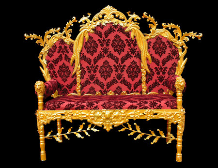 Old red golden king throne isolated over black background.の写真素材