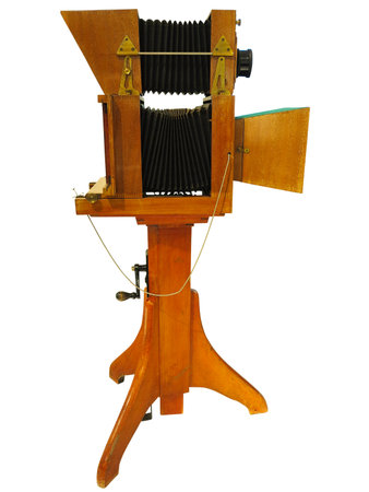 Vintage antique wooden old photo camera isolated over white backgroundの写真素材