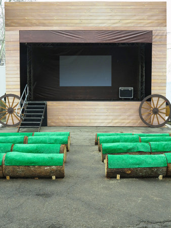 Empty street stage with green seats before the performance