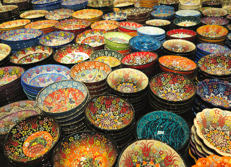 Handcrafted colorful decorated plates shot at the marketの写真素材