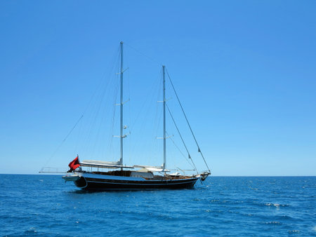 Sailing ship luxury brown wooden yacht in the blue seaの写真素材