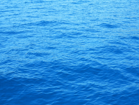 A deep blue sea water waves texture view from topの写真素材