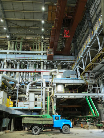 Industrial big water pumps with electric motors, pipes, tubes, equipment and steam turbine at modern power plantの写真素材