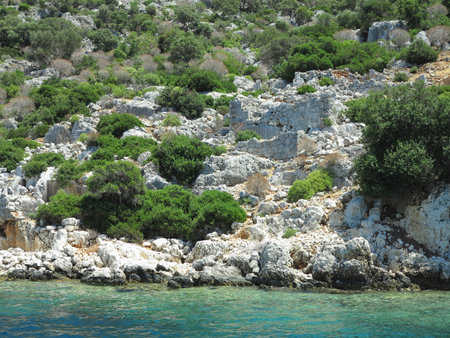 The sunken ruins on the island of Kekova Dolichiste of the ancient Lycian city of ancient Simena, was destroyed by an earthquake, rebuilt and existed until the Byzantine era. Antalya, Turkey.の写真素材