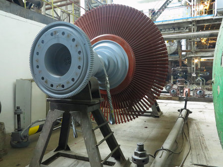 Power generator steam turbine in repair process, machinery, pipes, tubes, at an power plantの写真素材