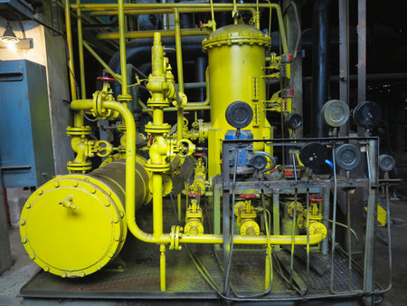 Industrial big water pumps with electric motors, pipes, tubes, equipment and steam turbine at modern power plantの写真素材