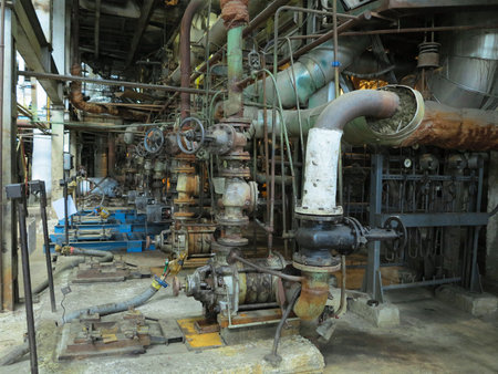 Industrial big water pumps with electric motors, pipes, tubes, equipment and steam turbine at modern power plantの写真素材