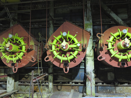 Giant gas-burners, glitter tubes, equipment, cables and piping inside of a modern industrial power plantの写真素材