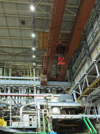 Industrial big water pumps with electric motors, pipes, tubes, equipment and steam turbine at modern power plantの写真素材