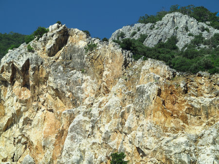 High marble rock mountains over blue sky backgroundの写真素材