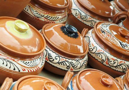 Beautiful handmade clay pots and other dishes sold at the fair shopの写真素材