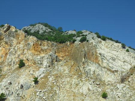High marble rock mountains over blue sky backgroundの写真素材