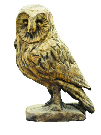 old wooden carved figurine of an owl with big eyes isolated on white backgroundの写真素材