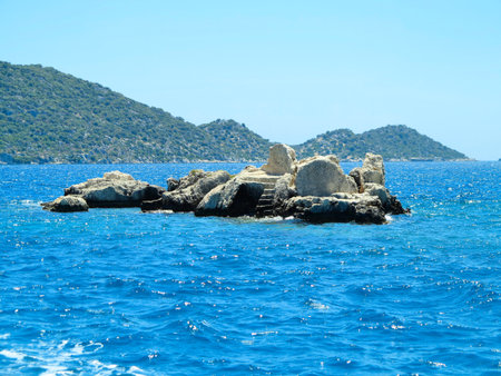 The sunken ruins on the island of Kekova Dolichiste of the ancient Lycian city of ancient Simena, was destroyed by an earthquake, rebuilt and existed until the Byzantine era. Antalya, Turkey.の写真素材
